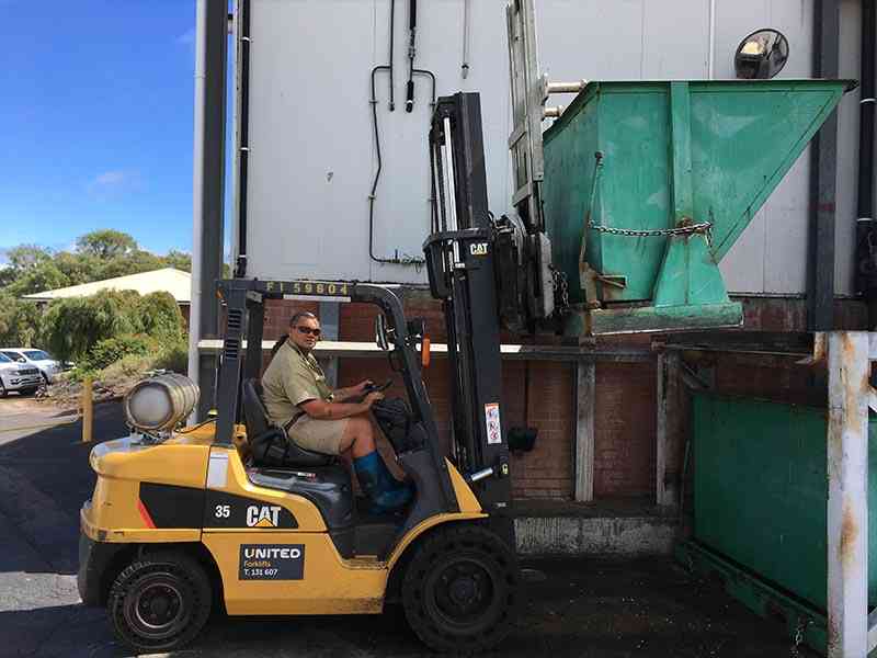 CAT LPG forklift with special attachment for waste disposal